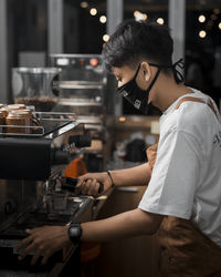 Side view of woman working at restaurant