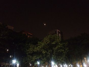 Low angle view of illuminated building at night