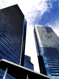 Low angle view of skyscraper against sky