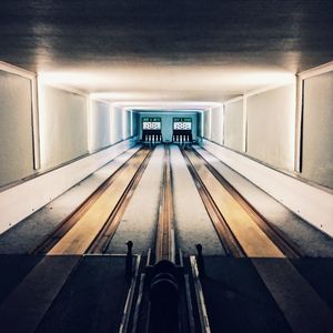 Man in illuminated tunnel