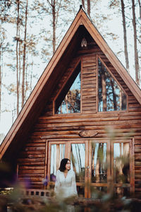 Women in pine forests and brown wooden houses