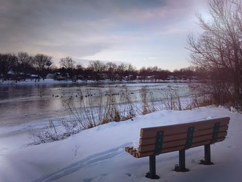 Scenic view of frozen lake against sky during winter