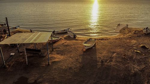 High angle view of abandoned beach against sky during sunset