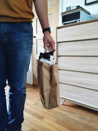 Low section of woman standing on tiled floor