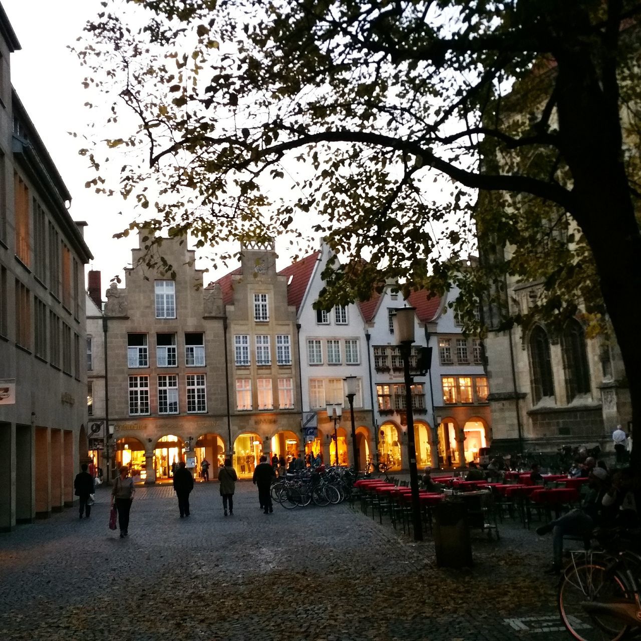 PEOPLE IN ILLUMINATED BUILDING