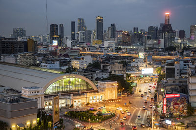 High angle view of illuminated buildings in city at night