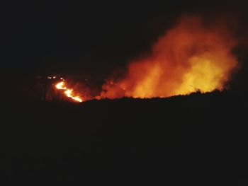 Silhouette of fire at night