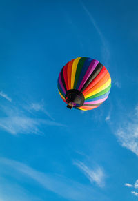 Low angle view of hot air balloon against blue sky