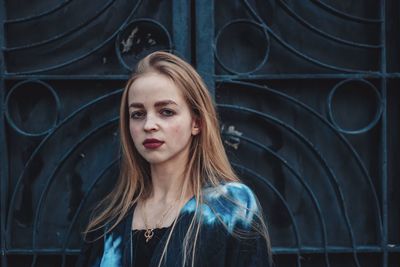 Portrait of beautiful young woman looking away