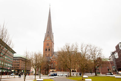 Buildings in city against sky