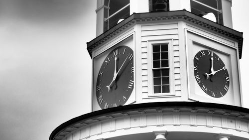 Low angle view of clock tower against sky