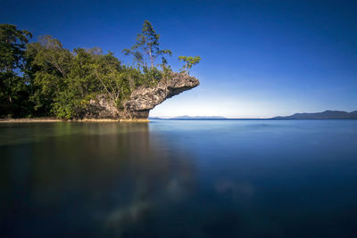 Scenic view of sea against blue sky