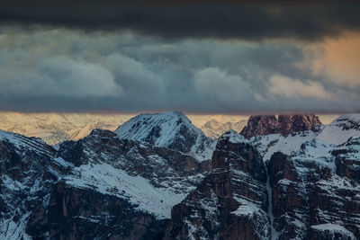 Snowcapped mountains against sky during winter