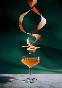 Close-up of champagne flute against black background