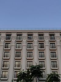 Low angle view of building against clear blue sky