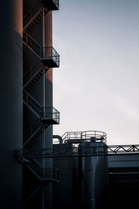 Low angle view of factory against sky