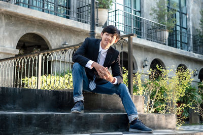 Portrait of young man using mobile phone