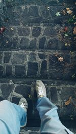 Low section of person standing on ground