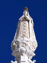 Low angle view of church against clear blue sky