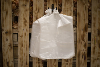 High angle view of plastic bag on wooden wall