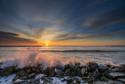 Scenic view of sea against sky during sunset