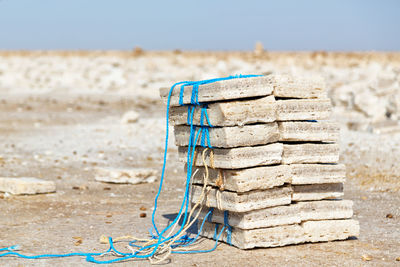 Close-up of ropes on sand