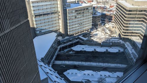 High angle view of buildings in city during winter