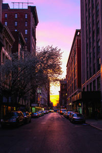 View of city street at dusk