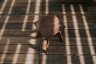 High angle view of umbrella on wooden floor