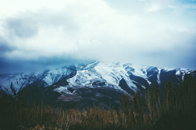 Scenic view of snowcapped mountains against sky