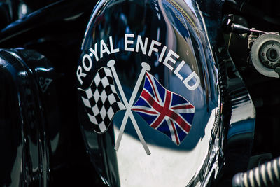 Close-up of flag against blue wall