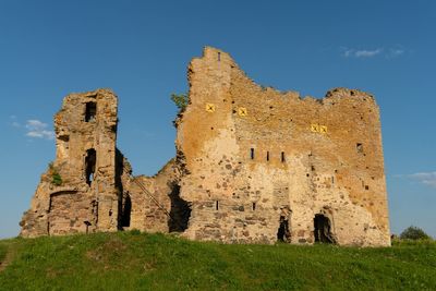 Low angle view of old castle against clear sky