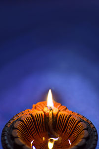 Close-up of lit candle