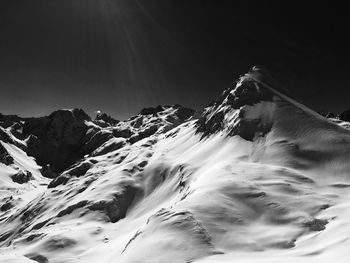 Scenic view of snow covered mountains