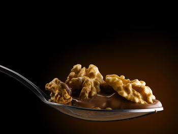 Close-up of breakfast on table against black background