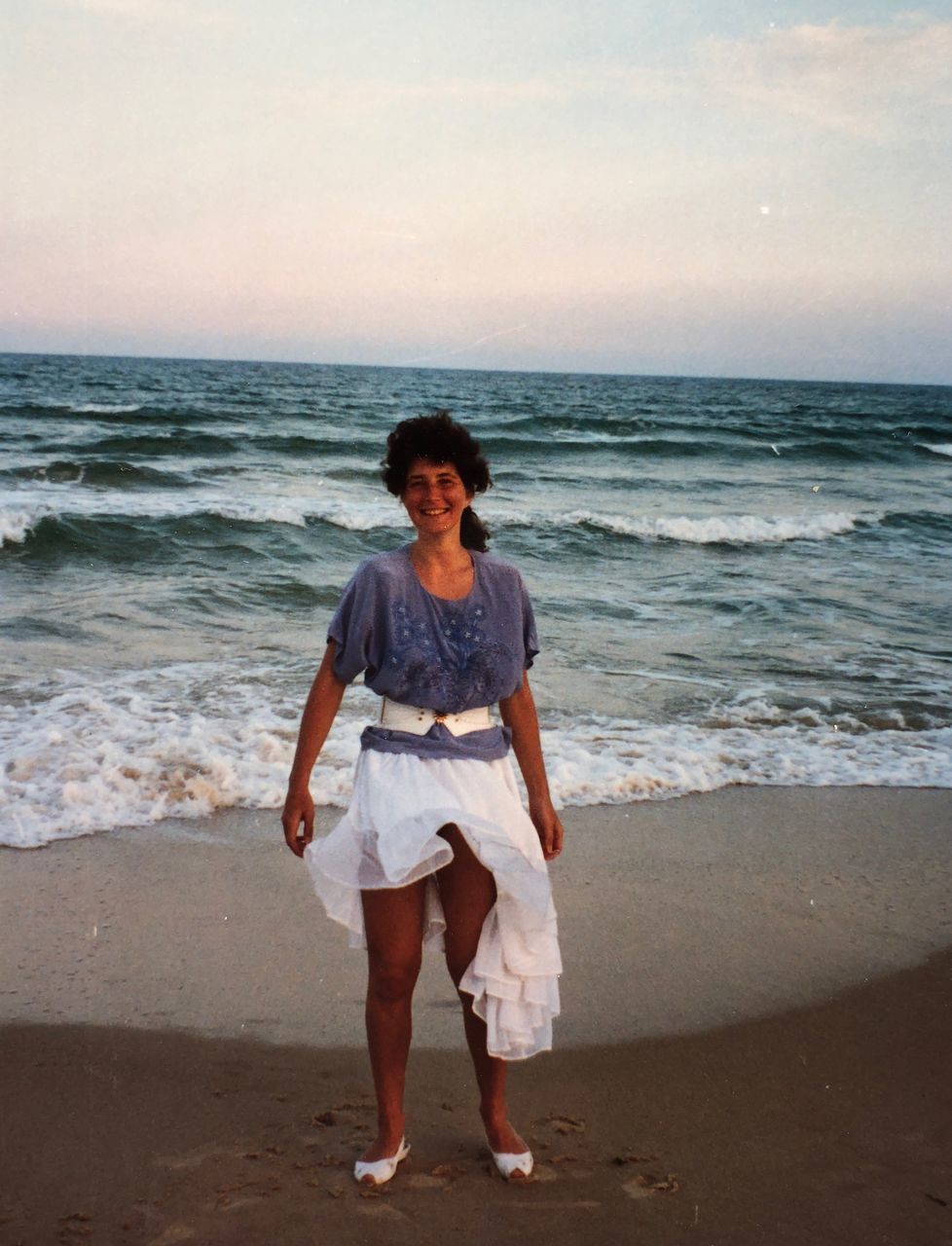 FULL LENGTH OF WOMAN STANDING ON BEACH