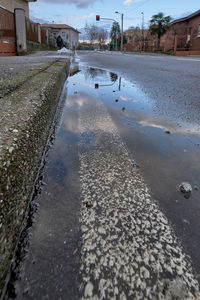 Reflection of buildings in puddle