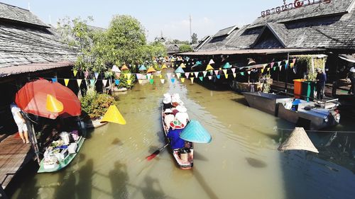 People enjoying in market during rainy season