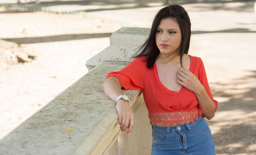 Model woman looking at camera during outdoors session