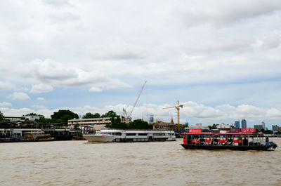 Nautical vessel on river against sky