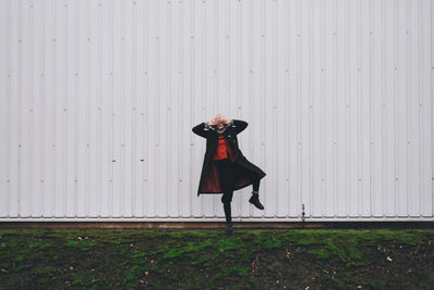 Woman standing on one leg