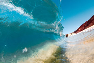 Close-up of sea waves against clear sky