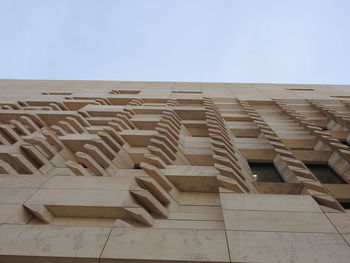 Row of built structure against clear sky