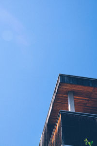 Low angle view of built structure against clear blue sky