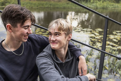 Two teenage boys sitting together