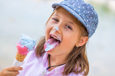 Portrait of girl eating ice cream