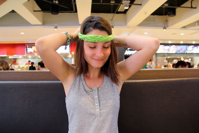 Young woman wearing headscarf at shopping mall