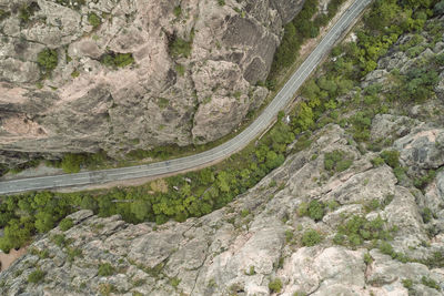 Directly above shot of road amidst rock mountain