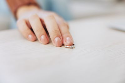 Cropped hand of woman with nail polish