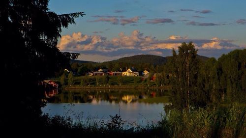 Scenic view of lake against cloudy sky